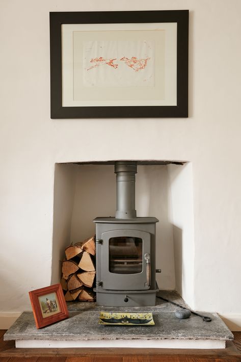 Woodburning stove and slate hearth installed as part of a sympathetic restoration of a Grade II Listed cottage in the heart of Boscastle, Cornwall.  Photograph:  Indigo Estate Agents. Georgian Cottage, The Pig Hotel, Bamboo Hedge, Cottage Flooring, Welsh Cottage, Woodburning Stove, Oak Floorboards, Marble Worktops, Conversation Area