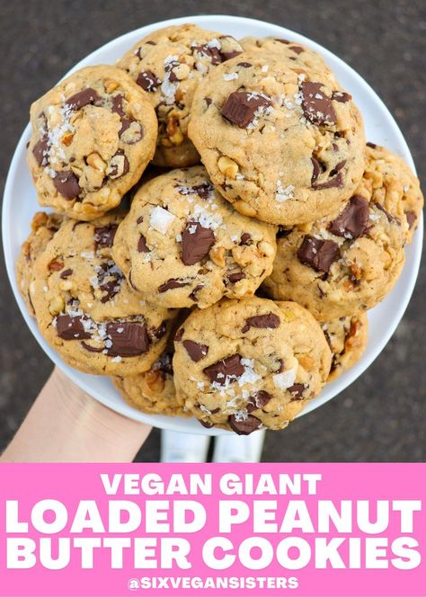 These cookies are loaded with peanut butter, vegan chocolate, crisp rice cereal, walnuts, and oats. They’re thick, soft, and chewy. And (of course) absolutely delicious. #vegan #veganrecipes #vegandessert #vegancookies #sixvegansisters Loaded Peanut Butter Cookies, Chewy Vegan Oatmeal Cookies, Large Vegan Cookies, Vegan Pb Cookies, Thick Cookie Recipes, Vegan Chocolate Peanut Butter Cookies, Vegan Peanut Butter Oat Cookies, Vegan Cereal, Chocolate Crisp