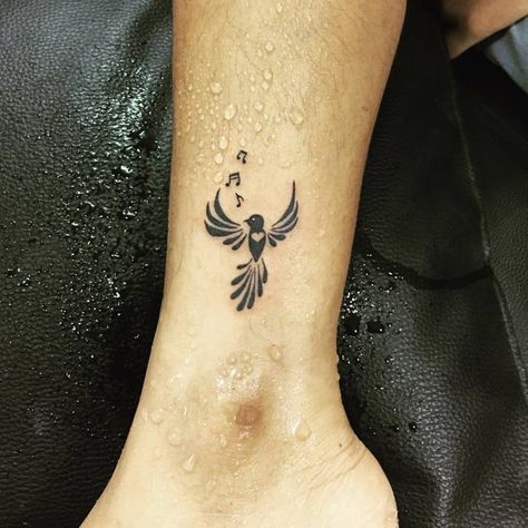 Bird Singing With Music Notes Tattoo Idea On Ankle Bird Wrist Tattoo, Music Bird Tattoos, Songbird Tattoo, Bird Tattoo Ideas, Music Bird, Bird Tattoo Meaning, Vogel Tattoo, Music Notes Tattoo, Bird Tattoo Wrist