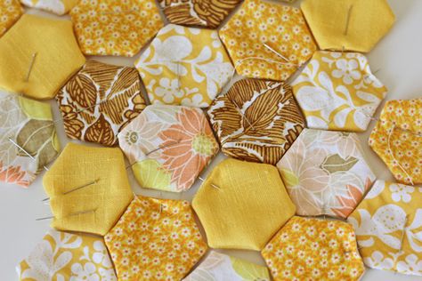 I’ve been meaning to make a hexagon quilt forever. It’s one of my lifelong dreams. All my sewing idols have done it. They are so pretty and would be such a neat keepsake. I really want a full size one to drape over my bed.But every time I think about making one I think about […] Hexagon Quilt Tutorial, Dog Bandana Pattern, Hexagon Patchwork, Hexie Quilt, English Paper Piecing Quilts, Quilt Vintage, Sketchbook Cover, Restaurant Ideas, Bee Party