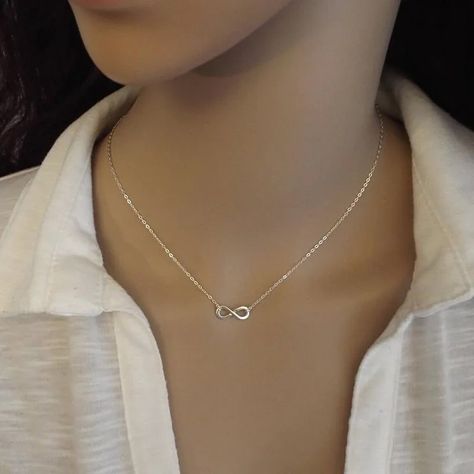 Infinity Abundance Pendant Choker Necklace Elevate your style with the Infinity Abundance Pendant Choker Necklace. Crafted from stainless steel, this elegant piece combines the infinity symbol with the concept of abundance. Ideal for women, it represents endless prosperity and makes a meaningful accessory for any occasion. #InfinityPendant #ChokerNecklace #StainlessSteelJewelry #FemmeNecklace #ElegantAccessory #FashionJewelry #ProsperityCharm #MeaningfulGift #AbundanceSymbol Infinity Symbol Necklace, Ethereal Jewelry, Infinity Necklace Silver, Engagement Necklaces, Pendant Choker Necklace, Infinity Sign, Infinity Pendant, Pendant Choker, Infinity Necklace