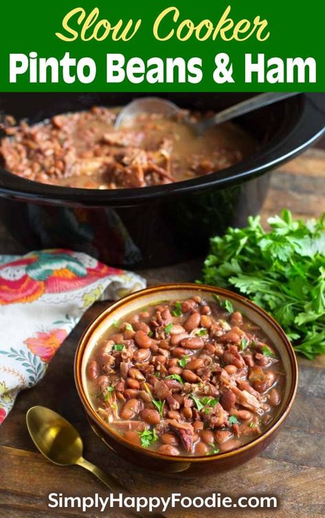 Slow Cooker Pinto Beans and Ham is a simple recipe that is hearty, filling, and delicious! This is real comfort food! This crock pot pinto beans and ham is a slow cooker dump and start recipe. So easy to make crock pot pinto beans. simplyhappyfoodie.com #slowcookerpintobeans #crockpotpintobeans Ham And Pinto Beans, Crockpot Pinto Beans Recipe, Pinto Beans And Ham, Crock Pot Pinto Beans, Pinto Bean Soup Recipes, Slow Cooker Pinto Beans, Crockpot Ham And Beans, Ham Hocks And Beans, Pinto Beans Recipe