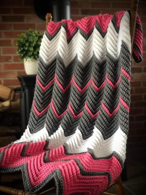 My latest chevron 🖤💗🖤. I used red heart with love in bubble gum(2-7oz skeins)rows of 2 and 10, red heart super saver in grey heather (3-5oz skeins)rows of 2 and 10 and RHSS in white(1-7oz skein)rows of 12(110 rows total). My starting chain was 177 and it’s about 36x44(no border) with a J hook😊  ￼   https://daisyfarmcrafts.com/single-crochet-chevron-blanket-in-min/ Chevron Baby Blanket Crochet Pattern, Zigzag Crochet Pattern, Ripple Crochet Pattern, Crocheting Tips, Boot Cuffs Crochet, Chevron Crochet Blanket, Crochet Ripple Afghan Pattern, Chevron Crochet Blanket Pattern, Chevron Crochet Patterns