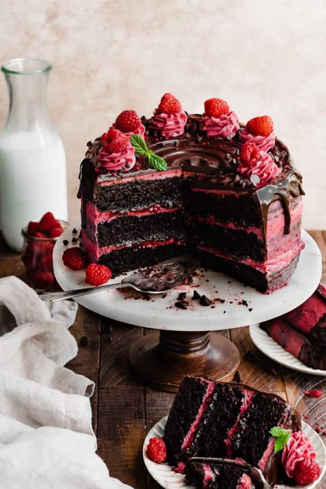 Chocolate Raspberry Cake has rich chocolate cake layers frosted with a Raspberry Cream Cheese Frosting, filled with raspberry preserves, and finished with a luscious chocolate ganache drip. This cake is ultra moist and packed with raspberry and chocolate flavor. It's the perfect cake for any celebration! Cake With Macarons On Top, Chocolate Cake Raspberry Filling, Raspberry Birthday Cake, Chocolate And Raspberry Cake, Raspberry Chocolate Cake, Raspberry Cake Recipe, Raspberry Cream Cheese Frosting, Chocolate Raspberry Cake Recipe, Chocolate Ganache Drip