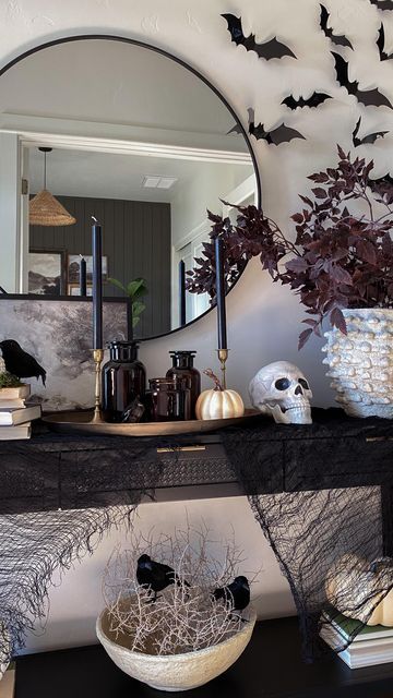 Home Inspiration and DIY by Theresa on Instagram: "I was busy thinking bout…I’ve been wanting to decorate one area in my home for Halloween and this is it! I call it classy spooky. Do you decorate for Halloween? I usually decorate one area in our home for Halloween and leave the rest for fall decor. ✨✨You can shop this post by following me @theresachristinehome on the @shop.LTK app or just click the link in my bio. #halloweendecor #halloweenideas #halloweeninspiration #falldecor #autumnvibes # Coffee Table Halloween Decor, Inside Halloween Decor, Halloween Foyer, Halloween Apartment Decor, Halloween Home Decor Indoor, Halloween Hosting, Halloween Fireplace, Decorate For Halloween, Cheap Halloween Decorations