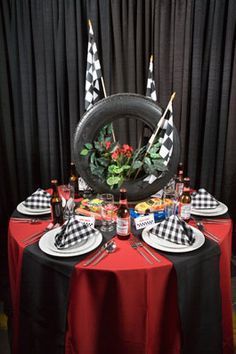 NASCAR Themed Race Centerpiece with Tire and Checker Flags Two Fast Two Furious, Car Centerpieces, Nascar Party, 50th Birthday Party Themes, Motorcycle Party, Biker Party, Race Car Themes, Car Themed Parties, Race Car Birthday Party