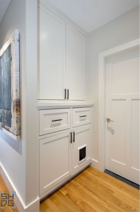 Storage built for the whole family, including your cat! Spot the cat door for a hidden litter box. #SlocumHallDesign #Storage #StorageSolutions #Cat #CatDoor #CreativeSolutions #InteriorDesign #Architecture #Boston #BostonDesign #BostonHomes #BostonArchitecture Laundry Room Ideas With Cat Litter, Cat Litter Box Ideas Hidden Cabinet, Cat Litter Box In Cabinet, Hidden Litter Robot, Cat Built In, Cat Litter Ideas Hidden, Cat Litter Robot Ideas Hidden, Built In Kitty Litter Cabinet, Litter Box Built In Cabinet