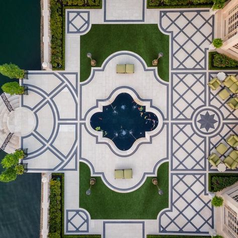 The waterfront patio behind this house is a space of formal elegance. Check it out at HGTV.com. Garden Rocks Ideas, Backyard Pool And Spa, Paving Pattern, Garden Rocks, Landscape Design Drawings, Sitting Areas, Classic Villa, Elegant Garden, Exterior Renovation