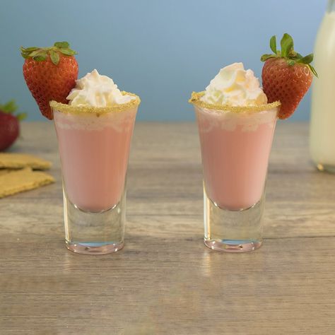 STRAWBERRY SHORTCAKE SHOT 1 Part Vanilla Vodka 1 Part Strawberry Liqueur Splash Amaretto 1 Part Cream/Half & Half Garnish: Graham Cracker Crumbs/Strawberry/Whipped Cream  PREPARATION 1. Rim edge of shot glass in graham cracker crumbs and set aside. 2. In an ice filled shaking glass combine liquors and mixer. Shake well and strain into prepared shot glass.  3. Garnish with whipped cream and a strawberry. DRINK RESPONSIBLY! Cherry Shots, Strawberry Shots, Shooter Recipes, Strawberry Liqueur, Chocolate Covered Cherry, Dessert Shooters, Strawberry Whipped Cream, Party Drinks Alcohol, Tipsy Bartender