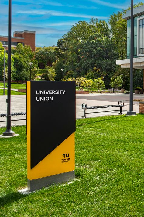 Exterior monument signage identifies University Union at Towson University. College Signage Design, Modern Monument Sign, Identification Signage, University Signage, Apartment Monument Signage, Campus Signage, Monument Signage, Donor Recognition Wall, Towson University