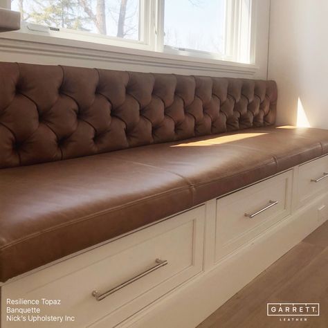 A stunning tufted banquette upholstered in our Resilience Topaz by @nicks_upholstery. Nick ensured the seat cushion was perfectly flush with the adjacent cabinets and that the back didn't extend over the window ledge. With the table and chairs now in place,this space is a perfect breakfast nook for cozy family dinners or entertaining guests. #garrettleather #nicksupholstery #interiordesign #banquette #kitchendining #leatherbanquette #breakfastnook #diningroom #leathercraft #leatherupholstery... Upholstered Dining Banquette, Velvet Breakfast Nook, Diy Booth Seating, Counter Height Banquette, Diy Dining Banquette, Dining Banquette Seating, Banquette Seating With Storage, Basement Seating, Upholstered Banquette Seating