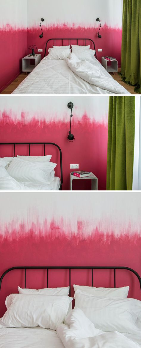 Oksana Dolgopiatova has designed a modern bedroom that features pink and white walls. While the lower part of the wall is solid pink, the top part of the pink blends into the white wall with visible vertical brush strokes creating an ombre effect. Purple And Pink Accent Wall, Pink And White Walls, White Modern Bedroom, Pink Painted Walls, Half Painted Walls, Pink Accent Walls, Watercolor Mural, Feature Wall Bedroom, Ombre Wall