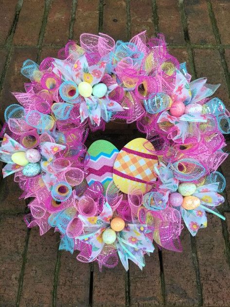 If you want to get your home ready for Spring, then check out these Dollar Store Easter Decorations to keep your budget on track. Wreath Diy Dollar Tree, Easter Wreath Diy Dollar Stores, Easter Crafts Dollar Store, Easter Mesh Wreaths, Deco Mesh Wreaths Diy, Easter Spring Wreath, Easter Wreath Diy, Easter Egg Wreath, Mesh Wreath Diy