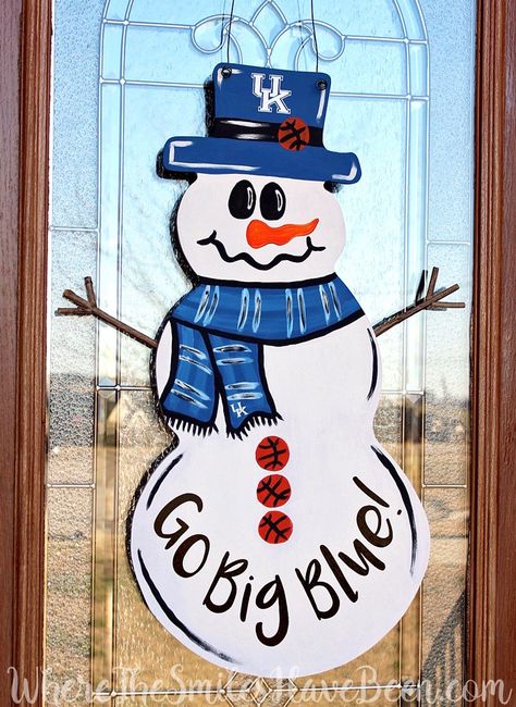 This is SO CUTE!  It can easily be changed for any team or sport and is the perfect winter wreath for any sports fan!  Univ. of Kentucky Basketball Snowman Door Hanger by WhereTheSmilesHaveBeen.com #BBN Uk Door Hanger Kentucky Wildcats, Snowman Door Hanger, Diy Silhouette, Ball Painting, Wooden Snowmen, Snowman Door, Door Hanger Ideas, College Diy, Burlap Door Hangers