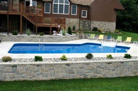 Retaining wall around above ground | Pool patio, Backyard pool ... Pools With Retaining Walls Sloped Backyard, Pool With Retaining Wall, Pool Retaining Wall, Pool Deck Ideas Inground, Dream Backyard Pool, Fiberglass Pool, Pools Backyard Inground, Sloped Backyard, Stone Retaining Wall