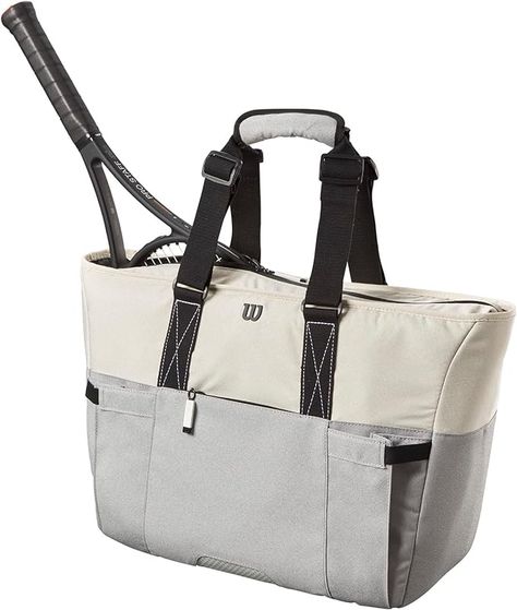 About this item 100% Polyester Imported Wilson Lifestyle Tote Tennis Racket Bag - 2 Pack, Grey/Blue Holds up to 2 rackets; Partial Racket Compartment: Enclose and secure the racket heads with a partial compartment that features locking zippers.; Thermoguard Accessory Compartment: Thermoguard lining keeps your smaller personal items and snacks safe from extreme changes in temperature. Tennis Racket Bag, Tennis Tote, Tennis Bags, Tennis Bag, Racquets, Alexa Device, Sport Tennis, Womens Tennis, Women Lifestyle