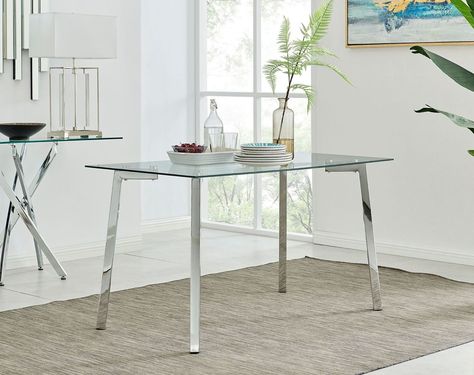 The Cosmo table is a simplistic yet stylish combination of chrome metal and glass. The table top is made from 8mm thick tempered safety glass that is very durable and hard wearing, whilst the 4 chrome metal legs keep the table sturdy. The table is sure to give a bright and spacious feel to your dining space by creating a light open look! There is also plenty of room for guests with a 130 x 75cm top.⁣ ⁣ Chrom And Metal Top Work Table, Vintage Chrome Table And Chairs, Glass And Chrome Dining Table, Vintage Metal Top Table Chrome Legs, Chrome Dining Table, 4 Seater Dining Table, Console Table Living Room, Stainless Steel & Glass Square Sude Table, Dining Table Sale