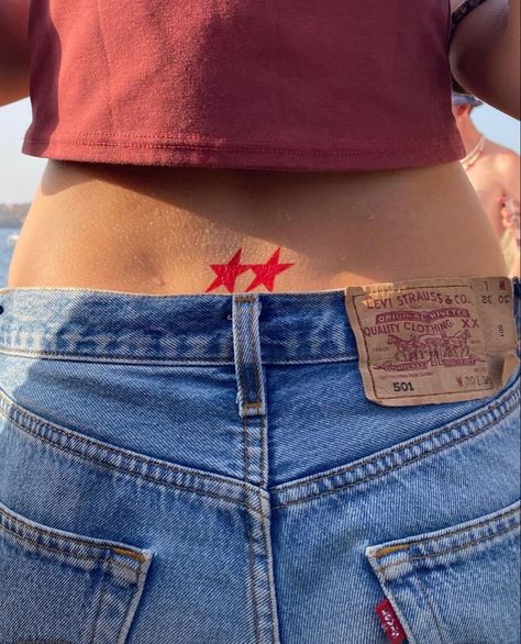 Lower Back Tattoos Stars, Red Ink Star Tattoo, Two Star Tattoo, Red Tramp Stamp Tattoos, Star Tattoo Stomach, Cool Star Tattoos, Dainty Red Tattoos, Red Tattoo Ideas Female, Reverse Tramp Stamp