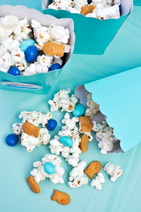 Throwing an ocean themed party? You will definitely want to include this Ocean Party Popcorn mix we made as a Shark Party Snack. It's the perfect sweet and salty snack mix that everyone will love! | The Love Nerds Whale Baby Shower Cake, Party Mix Snacks, Theme Snack, Party Popcorn, Ideas For Food, Popcorn Mix, Ocean Birthday Party, Ocean Theme Party, Food Decorations