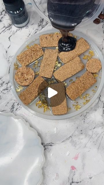 Resin About | Katherine Price on Instagram: "Well you guys enjoyed the last reel of this make so here’s a slightly different version...this collection of handmade coasters featuring wine corks and mesmerizing gold leaf on sleek black shimmering resin - Finished piece shown at the end 🖤✨

These coasters are a beautiful fusion of classic and contemporary design. Each coaster is meticulously handcrafted, incorporating real wine corks that bring a touch of rustic charm. The wine corks are showcased within a striking black resin, adorned with luxurious gold leat accents, creating a stunning contrast that catches the eye.

Set the stage for your next wine tasting or gather around with friends for a refreshing cocktail - these coasters are the perfect conversation starter.

Elevate your sips in Cork Art Projects, Crafts With Wine Corks, Wine Cork Coasters, Cork Crafts Christmas, Resin Creations, Refreshing Cocktail, Wine Cork Crafts, Resin Ideas, Wine Corks