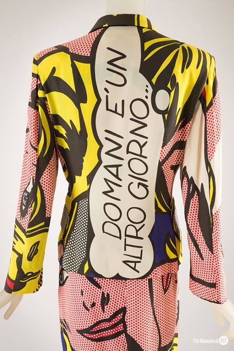 Moschino Cheap and Chic suit with Roy Lichtenstein print, 1991. Collection of The  Museum at FIT. #FakingItFashion  Franco Moschino recreated Roy Lichtenstein’s painting Girl with Ribbon Hair on this suit. To avoid any copyright violations, he requested permission from the artist. Yet Moschino gives the suit a personal flair by using an Italian translation of “Tomorrow is another day” in the speech bubble. Visit: http://exhibitions.fitnyc.edu/faking-it/ Camp Fashion, Art Inspired Fashion, Franco Moschino, Pop Art Fashion, Painting Girl, Tomorrow Is Another Day, Camp Style, Moschino Cheap And Chic, Roy Lichtenstein