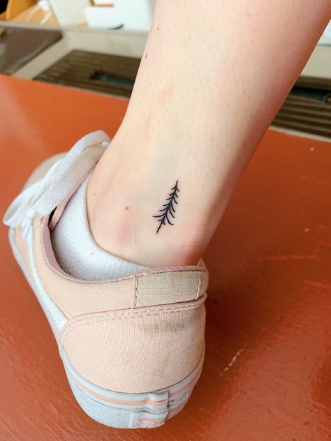 I got this flash tattoo on Friday the 13th for $13! I got it at Village Pop Tattoo in Manhattan, I’m so happy with how it came out. It reminds me of Vermont and skiing in the mountains with my friends and family. #tattoo #minimalisttattoo #treetattoo #fridaythe13thtattoo #tattoos #tinytattoo #smalltattoo Small Pine Tree Tattoo Simple, Tiny Evergreen Tree Tattoo, Simple Evergreen Tree Tattoo, Fine Line Evergreen Tattoo, Tiny Pine Tree Tattoo, Dainty Tree Tattoo, Vermont Tattoo Ideas, Tattoos For Women On Hand, Ski Tattoo Simple