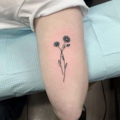 Black Ink Aster Flower Tattoo Aster Flower Tattoo With Name, Small Aster Flower Tattoo, Flower Tattoo With Name, Aster Flower Tattoo, Pop Tattoo, Flower Tattoo Meaning, Aster Tattoo, Aster Flower Tattoos, Tatts Ideas