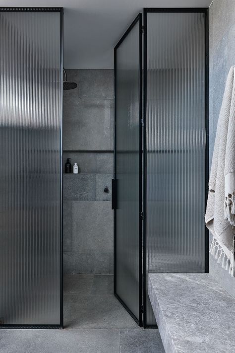 JCB Architects creates multi-generational residence | Habitus Living Black Frame Shower Enclosure, Grey Minimalist Bathroom, Glass Shower Wall Panels, Industrial Chic Bathroom, Ribbed Glass Door, Glass Shower Door, Casa Country, Industrial Bathroom, Bathroom Modern