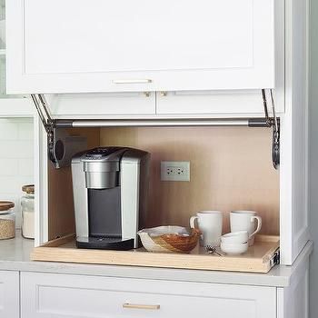 Kitchen Cabinet With Garage Style Door Design Ideas Coffee Hidden Cabinet, Pull Up Kitchen Cabinet Doors, Hidden Coffee Station, White And Brass Kitchen, Bar Kitchen Ideas, Appliances Cabinet, Kitchen Terracotta, Ivory Cabinets, Small Coffee Bar Ideas