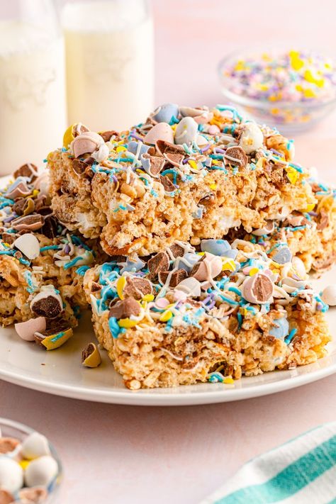 Indulge in these Easter Rice Krispie Treats! These delicious homemade goodies feature pretzels and mini Cadbury eggs. Drizzle them with vibrant Easter candy melts and enjoy these blissful, crave-worthy Cadbury egg rice crispy treats. Easter Egg Rice Krispie Treats, Easter Rice Krispie Treats, Egg Rice, Cadbury Eggs, Homemade Goodies, Hearty Comfort Food, Rice Crispy Treats, Crispy Treats, Rice Krispie Treats