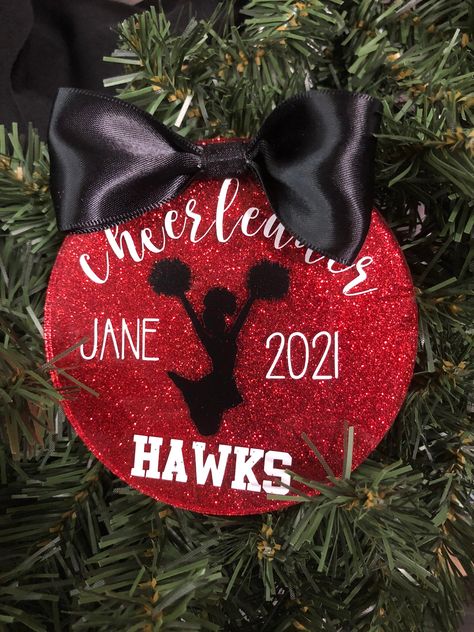 Personalized cheerleading ornament.  Customize with bow color, glitter or paint color and font color.  Cheerleader will be black.  Bow will be black unless another color is specified.  Message us for special orders. Orders are taking 1 day to process and ship.  If you need something in a rush, please message us for availability. Message us or visit our store for other sports, clubs or businesses.  We will work with you to custom make ornaments to most requests. Cheer Mom Ornament and Keychain so Cute Cheer Gifts, Cheer Gift Bags, Cheer Squad Gifts, Cheer Banquet, Cheer Coach Gifts, Cheer Team Gifts, Cheer Coach, Cheerleading Gifts, Pom Pom Girl