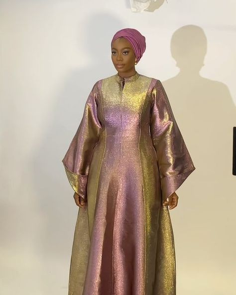 Rawsilk | Eid Dresses | Modest Fashion | Scarves | on Instagram: "Look 4   Metallic two toned Kaftan in magenta and gold  Also available in maroon and gold   Fabric: luxury Damask   Price : N95,000 Raw silk scarf : N6,500  Kindly click link in bio to place order  Worldwide shipping available" Metallic Organza Dress, Metallic Fabric Dress, Organza Bubu, Silk Abaya, Kaftan Styles, Damask Dress, Eid Dress, Long African Dresses, African Inspired Clothing