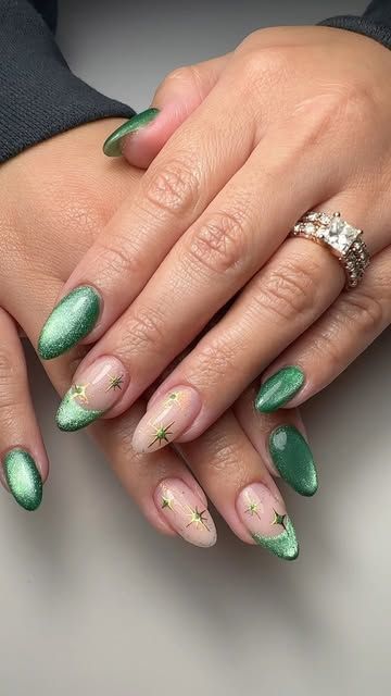 Jenny J Nailz on Instagram: "Hard gel structure manicure @nailthoughts Baby Cakes Base And custom mix green cat eye magnetic French With glitter confetti and gold stars. Green Christmas nails." Cute Emerald Nails, Almond Shaped Nails Designs Nye, Structure Gel Nails Design, Green Cat Eye Nails Christmas, New Years Nail Designs Cat Eye, Dark Green Cateye Nails, Forest Green Cat Eye Nails, Cat Eye Nye Nails, Olive Cat Eye Nails