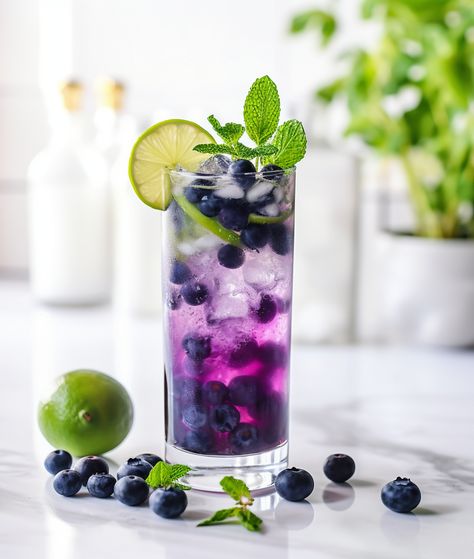 Blueberry mojito Lemon And Mint, Blueberry Mojito, Blueberry Mint, Cocktail Umbrellas, Popular Cocktails, Nugget Ice Maker, Nut Free Recipes, Blueberry Juice, Colorful Cocktails