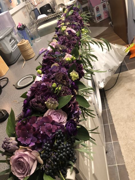 Gorgeous mix of purple flowers arranged to adorn the edge of the top table #flowers #wedding #weddingflowers #purple #gothic #floral #roses #lilac #hydrangea #garlands #tabledecor Lilac Floral Arrangements, Wedding Centerpieces Purple, Purple Hydrangea Wedding, Hydrangea Garland, Purple Wedding Centerpieces, Flower Garland Wedding, Plum Wedding, Wedding Purple, Hydrangea Colors