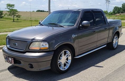 Auction ends June 22nd! This 2002 Ford F-150 Supercrew Harley-Davidson edition pickup has been one-family-owned in Indiana since new and has been driven 21,181 miles. It comes with a color-matched tonneau cover, 20-inch chrome wheels, fog lamps, a billet grille, and special badging. Power was engineered by Ford’s Special Vehicle Team (SVT) and comes from a 5.4-liter supercharged Triton V8 paired with a 4-speed automatic transmission. Visit AutoHunter.com! 2002 F150 Supercrew, Ford F 250 Super Duty King Ranch, 2002 Ford F150, 2001 Ford F150 Supercrew, 2001 Ford F150, Ford F150 Harley Davidson, 2003 Ford F250 Super Duty, Svt Lightning, Chrome Wheels