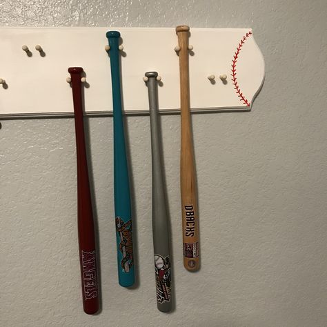 Baseball Bat Storage Ideas, Baseball Bat Storage, Baseball Bat Shelf, Wooden Baseball Bat Ideas, Mini Baseball Bat Display, Baseball Bat Wall Mount, Baseball Bat Holder, Baseball Bat Rack, Baseball Bat Display