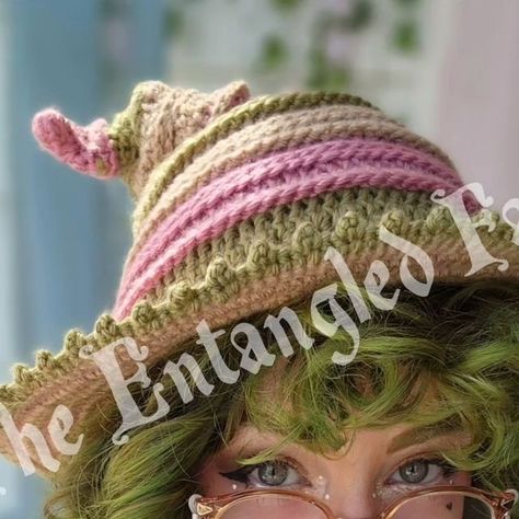 The Entangled Fae on Instagram: "Updates about this hat design/pattern release ✨️ First and foremost I want to thank y'all for a super successful release last night. All the items sold out within 4 minutes - which is the fastest I've sold out in the history of running The Entangled Fae. Thank you thank you thank you for believing in me and supporting my art. 😭 Now, I'm excited to share with y'all that I decided to go with one of your suggestions and have named this design the Twisteria Witch Crochet Fairy Hat Pattern, Crochet Pointed Hat Pattern Free, Fae Crochet, Crochet Fairy Hat, Crochet Fairy, Eyeglass Chain, Witch Hat, Hat Designs, Hat Pattern