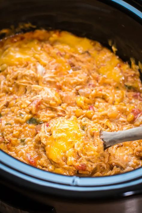 Slow Cooker Fiesta Chicken and Rice Casserole - The Magical Slow Cooker Chicken Spanish Rice, Spanish Rice Casserole, Fiesta Chicken And Rice, Bolivia Recipes, Casserole Slow Cooker, Magical Slow Cooker, Fiesta Chicken, Chicken And Rice Casserole, The Magical Slow Cooker