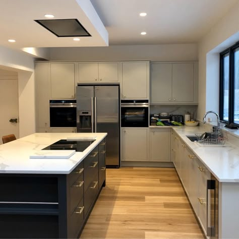 Large Kitchen Island🙆   Whether it is for a breakfast bar, extra storage or more room to cook, having a kitchen island has many benefits. Our kitchen designer Charlie even added a lovely wine rack to the side of this island - making this island perfect for hosting!  #Island #Kitchen #DarkCabinets #Decor #KitchenDecor #KitchenDesigner #KitchenDesign #InteriorDesign #Kitchen #ModernKitchen #DarkKitchen #WhiteWorktops #QuartzWorktops #KitchenRefurb #BreakfastBar Kitchen Island With Cook Top Ideas, Kitchen Island With Windows Behind, Kitchen With Range In Island, Stove Top On Island Kitchen Layouts, Cooker On Island Kitchen, Cook Top On Island, Kitchen With Centre Island, Kitchen Island Cupboard Ideas, Induction Hob On Island Kitchen