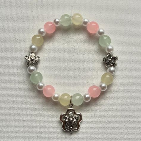 Selling on my instagram: norigazing #handmade #jewelry #bracelet #lightpink #softpink #flower #flowercharm #lightyellow #lightgreen #flowers #white #beads #aesthetic #smallbusiness Beads Aesthetic, Instagram Light, Flowers White, Jewelry Bracelet, Colorful Bracelets, Flower Charm, White Beads, Light Yellow, Soft Colors