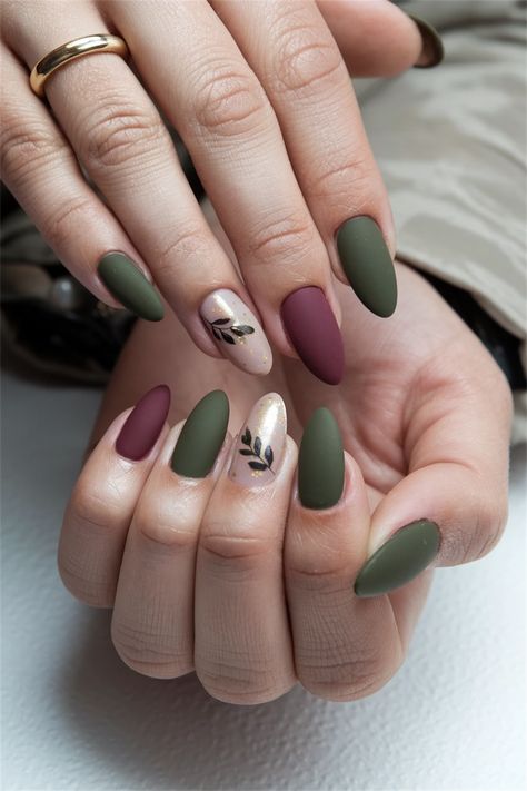 Embrace the essence of the season with these elegant fall nail ideas that perfectly capture an Autumn simple vibe. Picture a rich, burnt orange base adorned with delicate gold leaf accents窶蚤n effortlessly chic way to showcase your love for the season. These nails are not just stylish; they embody the warmth and beauty of autumn. Elevate your manicure game and let your nails reflect the cozy charm of fall! Fall Nails Sage Green, Classy Fall Nails Green, November Nails Ideas Green, November Nails Almond Short, Autumnal Green Nails, Green And Brown Fall Nails, Green November Nails, Fall Foliage Nails, Fall Nail Designs Sage Green