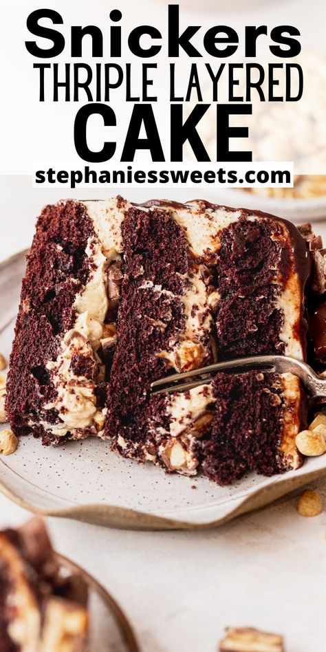 This layered Snickers cake has moist chocolate cake layers. They are stuffed with peanut butter frosting and fun sized Snickers. On top is a salted caramel frosting and two types of drips! Layered Chocolate Cake, Caramel Dessert, Snickers Cake, Caramel Dessert Recipes, Heavenly Desserts, Salted Caramel Frosting, Spring Recipes Dessert, Gourmet Cakes, Caramel Desserts