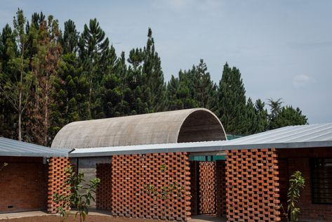 Our Lady of Victoria Monastery was originally established in Kenya in 1952. It hosts a community of monks from the Cistercian Trappist order who moved to Uganda in 2008 following post-election unrest in Kenya. Localworks’ architectural proposal followed a requirement to double the existing monastery in size and accommodate a growing community of monks. The design includes a total of four new buildings – Church, Noviciate, Guesthouse, and Gatehouse. All buildings are intricately detailed in clay Architectural Proposal, Brick Roof, Guest House Plans, Construction Images, Courtyard Design, Sacred Architecture, Photovoltaic Panels, Religious Architecture, Earth Design