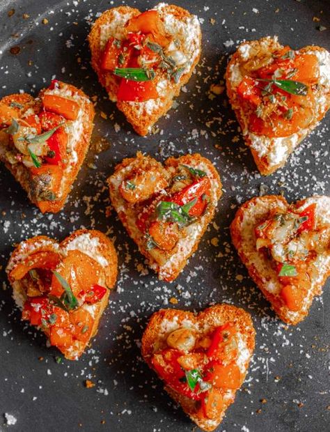 Valentine's Day is tomorrow which means it's the perfect time to make some adorable heart-shaped recipes. From Heart Shaped Treats for Kids to Heart-Shaped Heart Shaped Quiche, Heart Shaped Party Food, Galentines Party Meal, Heart Shape Appetizer, Valentine Party Appetizers, Valentines Recipes Appetizers, Valentines Food Ideas Party Appetizers, Valentines Starters, Italian Valentines Dinner