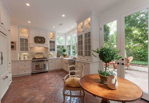 From your foyer to your kitchen, high-traffic interior spaces could benefit from price-wise, easy-care surfaces like brick floors. Here's why. Brick Kitchen Floor, French Door Decor, Brick Floor Kitchen, Brick Floors, Brick Floor, Cottage Style Kitchen, Brick Kitchen, American Kitchen, Cottage Kitchens