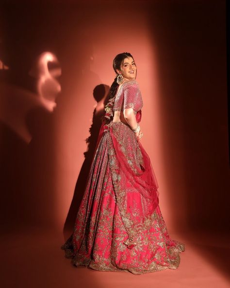 Gorgeous @aasthashah97 in "Cynthia" Fuschia Raw Silk Bridal Lehenga Set for #ambaniwedding Fuschia raw silk bridal lehenga with a tulle dupatta and a tulle veil. Embroidered blouse. Available at Delhi and Mumbai stores #ambani #ambaniwedding #basra #indianbride #dollyjstudio #weddinggown #weddinginspo #dollyjbride #dollyjlehenga #dollyjgown #couture #bridalgown #wedmegood #lehenga #dollyj #summercollection #bridalgowns Silk Bridal Lehenga, Tulle Veil, Tulle Veils, Wedding Couple Poses, Bridal Lehenga, Embroidered Blouse, Raw Silk, Couple Posing, Indian Bride