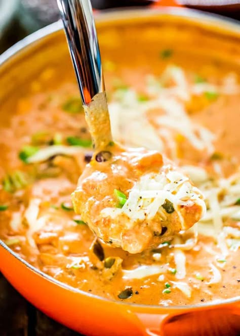 This Creamy Cheesy Chicken Enchilada Soup is a fiesta of flavors full of chunks of chicken, black beans, corn and diced tomatoes, for a complete satisfying and comforting bowl of soup. #enchiladasoup Cheesy Chicken Enchilada Soup, Soup With Cream Cheese, Lime Corn, Creamy Enchilada, Chicken Enchilada Soup Recipes, Enchilada Soup Recipe, Dutch Oven Chicken, Cheesy Chicken Enchiladas, Creamy Chicken Enchiladas