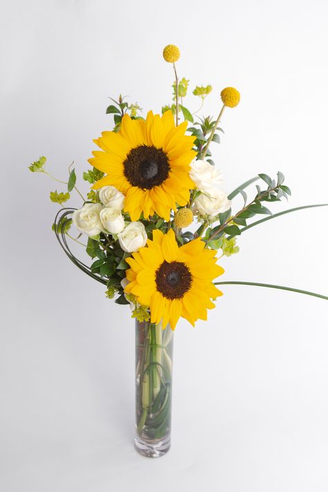 These locally-grown sunflowers are the perfect way to show gratitude for Administrative Professionals Week! This cheerful display of sunflowers and ivory mini roses comes in a classic slender glass cylinder budvase. Bring some sunshine to their workspace with these bright blooms - Click Link to Shop Sunflower Arrangements Vases, Red Roses And Sunflowers, Sunflower Floral Arrangements, Bud Vase Centerpiece, Welcome Flowers, Sunflower Vase, Rose Spray, Small Flower Arrangements, Sunflower Arrangements