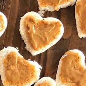 Sandy Coughlin on Instagram: "Valentine’s Day LUNCH Charcuterie Board is filled with heart-shaped peanut butter and jelly sandwiches, meat, cheese, fruit, nuts, and chocolate! ❤️ Share with someone you love! ❤️ Recipe link in profile https://reluctantentertainer.com/valentines-day-lunch-charcuterie-board/ #lunchboard #heartpbj #pbjforever #valentinesdayboard #reluctantentertainer" Lunch Charcuterie Board, Lunch Charcuterie, Nuts And Chocolate, Peanut Butter And Jelly, Charcuterie Board, Nuts, Peanut Butter, Jelly, Peanut